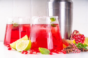 Pomegranate mocktail or cocktail, Boozy alcohol pomegranate and lime drink, lemonade, mojito, margarita with frozen rim