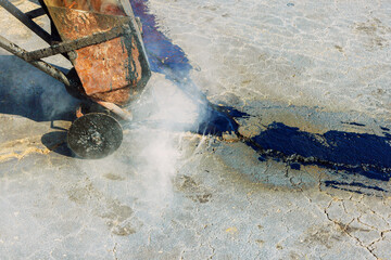 Joint seal filler liquid to repair cracks in asphalt with bitumen emulsion joint seal restorer to...