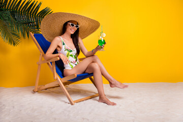 Full length photo of beautiful shiny girl dressed bodysuit relaxing lounge chair drinking cocktail...