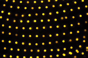 Gold abstract christmas bokeh on black background