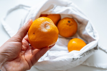 tangerines in fabric bag