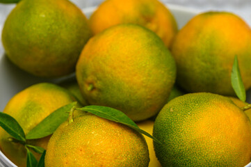 delicious fresh green-orange tangerines as background 1