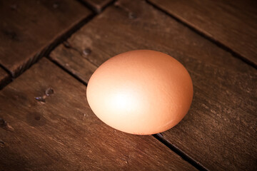 Egg on a rustic wooden board