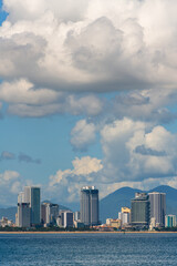 View of the sea bay and the Vietnamese city of Nha Trang on a sunny cloudy day