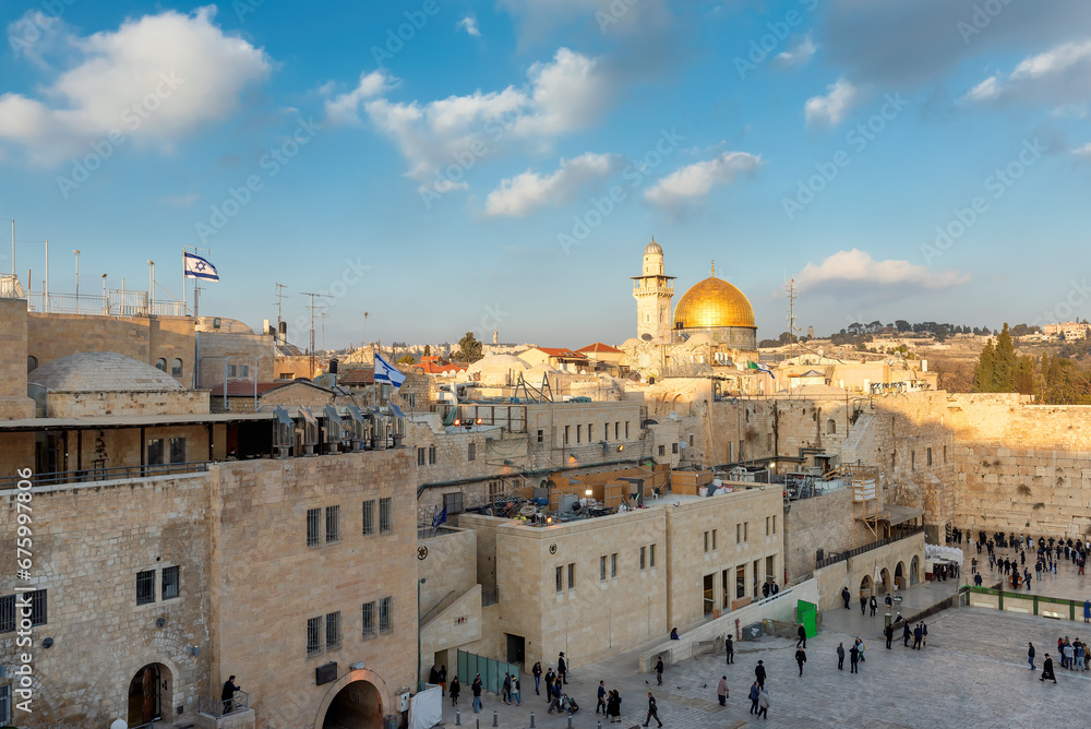 Wall mural The old city of Jerusalem at sunset, including the Western Wall and golden Dome of the Rock, Jerusalem, Israel.