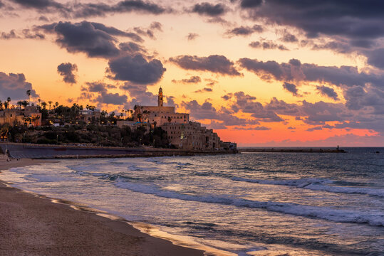 Old town of Jaffa over the sand beach bay on sunset, Tel Aviv, Israel.