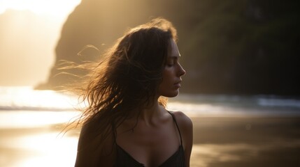 Fototapeta premium Young woman emerging from the sea on a beach