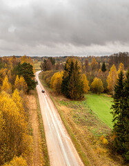 Autumn landscape with country road. Latvia.