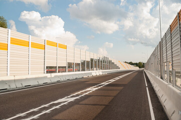 new asphalt road close-up in the background sky and clouds
