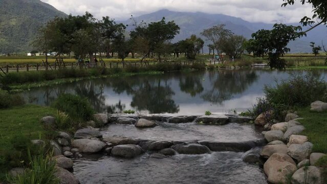 Beautiful secret scenery.Mountain view in the distance,lake sight and flowing water nearby form a scenic scene.High quality video photography in Dagufan Secret, Guanshan Town, Taitung County, Taiwan.