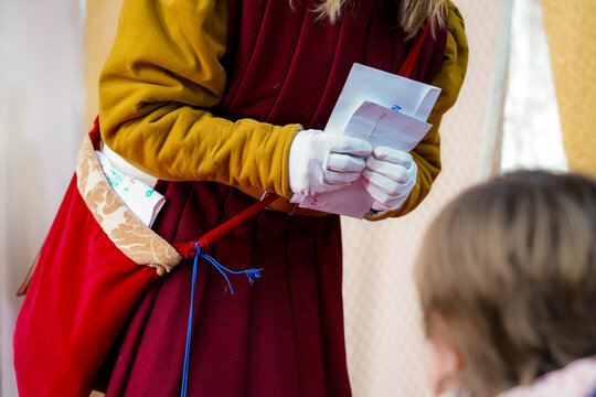 Child waiting to deliver letter to the king. Three Magic Kings in the parade, spanish wise men. Christmas celebration