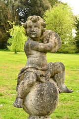Statue of a child,  Woodstock Gardens and Arboretum, Inistioge, County Kilkenny, Ireland