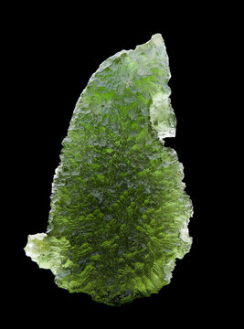 Green tektite close up. Czech moldavite gemstone. Natural impact glass. Isolated on black.