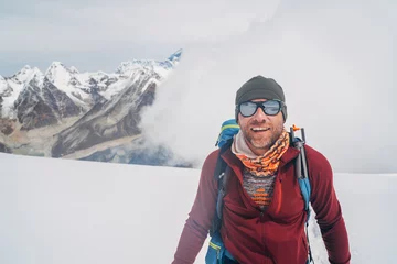 Photo sur Plexiglas Lhotse Cheerful laughing climber in sunglasses portrait with backpack ascending Mera peak high slopes at 6000m enjoying legendary Mount Everest, Nuptse, Lhotse with South Face wall beautiful High Himalayas.