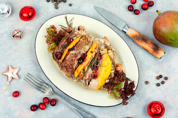 Meatloaf with mango on a plate.