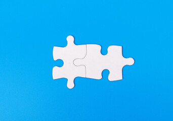 Two blank puzzle pieces connected together. Perfect match, connection concept