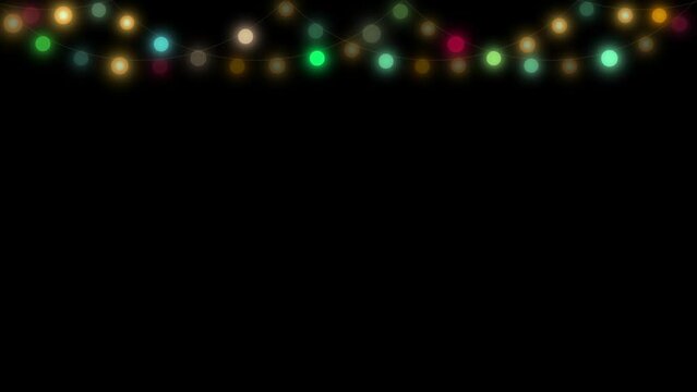 Light bulb string with Christmas lights of various colors against a black background.
