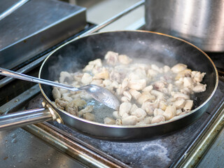 Top view of filling for chicken pot pie thickening in pot