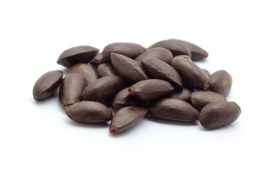 Heap of custard apple seeds isolated on a white background.