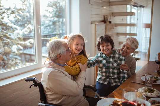 Joyful Family Meal with Grandparents and Grandchildren