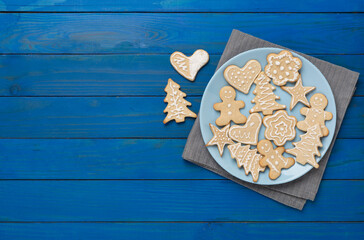 Cute homemade Christmas cookies on wooden background,top view