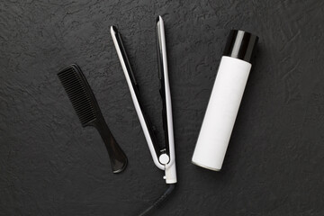 Hair straightener with thermo protection on concrete background, top, view