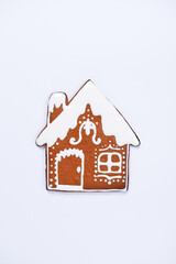 The hand-made eatable gingerbread house on white background - 676045036