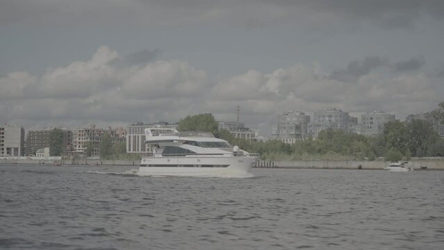 St. Petersburg - Russia, June 2023: A luxury white yacht sails on the Neva River in St. Petersburg. Rich people have fun on a luxury yacht. S-log3