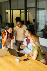 Young multiethnic startup team working in the modern office