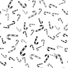 Black Christmas candy cane with stripes icon isolated seamless pattern on white background. Happy Halloween party. Vector