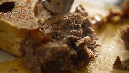 Macro Culinary Art - Close-Up Fork Shredding Meat in Meal Preparation