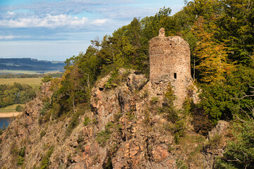 The ruins of castle "Oheb" above the "Sec" dam in autumn. Czech republic.
