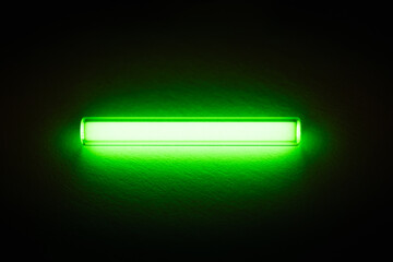Tritium. Radioactive glow. Gaseous tritium light source in a glass vial. Radiation green glow...
