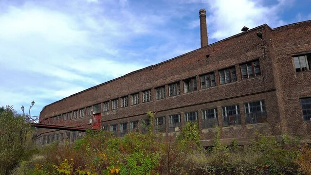 An old industrial abandoned building, brick, broken glass, empty - (4K)