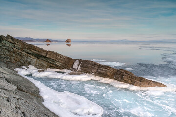 Sea winter landscape. Sea slush and ice floes on the sea surface in winter during sunset. Fabulous...