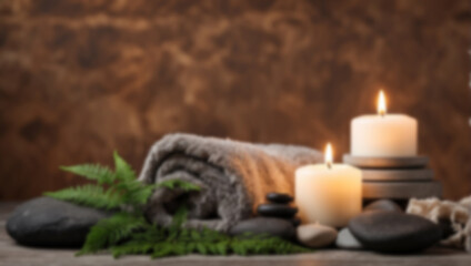 Obraz na płótnie Canvas Blur Towel on fern with candles and hot stone on white wooden background. backdrop with copy space