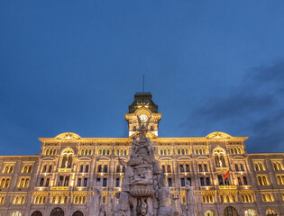 Obraz premium Piazza Unità d'Italia (Unity of Italy Square) located at the foot of the hill with the castle of San Giusto and facing the Adriatic Sea. Trieste, Friuli Venezia Giulia, northeast Italy