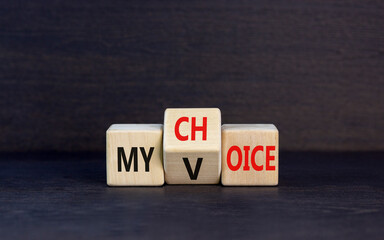 My voice choice symbol. Businessman turns wooden cubes and changes the concept word My choice to My...