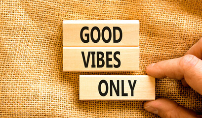 Good vibes only symbol. Concept word Good vibes only on beautiful wooden block. Businessman hand....