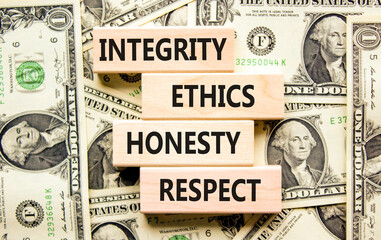 Integrity ethics honesty respect symbol. Concept word Integrity Ethics Honesty Respect on block. Dollar bills. Beautiful background from dollar bills. Business integrity ethics honesty respect concept