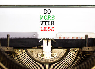 Do more with less symbol. Concept word Do more with less typed on beautiful old retro typewriter. Beautiful white paper background. Business do more with less concept. Copy space.