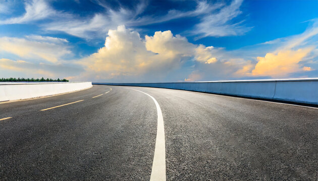 empty asphalt road and blue sky with white clouds road background