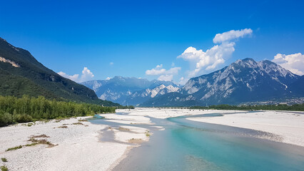 Scenic view of braided river Tagliamento running through mountainous landscape with in Friuli-Venezia Giulia, Italy, Europe. Clear blue water flowing in natural wilderness. Peaceful serene scene