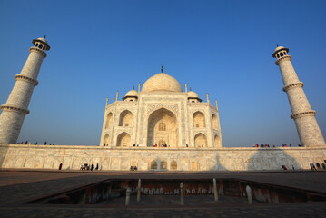 View of the Taj Mahal at sunrise is an ivory-white marble mausoleum on the right bank of the river...