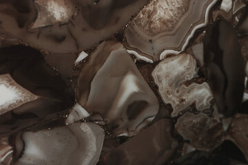 Brown marble background. Various geometric shapes on background. Flat lay. Top view. Copy space.