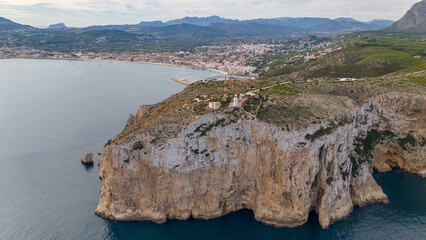 Aerial drone photo of the lighthouse at the cliffs of Cap de Sant Antoni in Javea, Spain