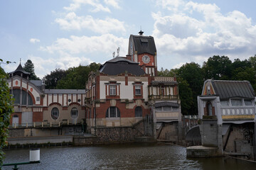 Hradec Kralove, Czech Republic - July 22, 2023 - the historic building of a hydroelectric power station  in the middle of summer 