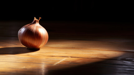 Lifestyle product shot of beautiful ideal shape of fresh onion on a wooden table. Play light and shadow