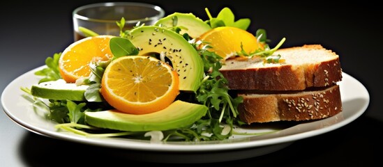 A green colored lemon and avocado salad is a nutritious addition to a healthy breakfast providing a refreshing burst of flavor against the background of whole grain bread and a variety of f