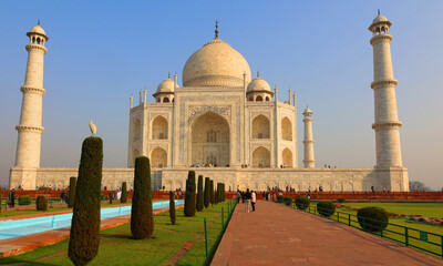The Taj Mahal at sunrise is an ivory-white marble mausoleum on the right bank of the river Yamuna...